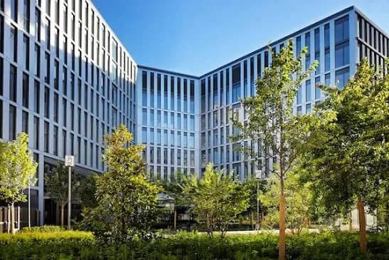SFR campus buildings around a landscaped courtyard